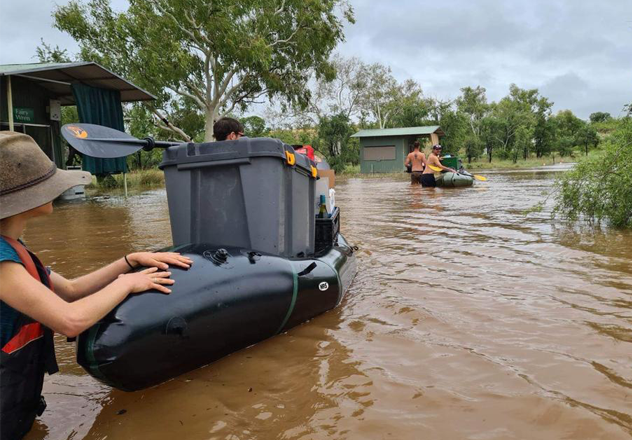 Using packrafts to ferry equipment over the flood waters to a safe high point.