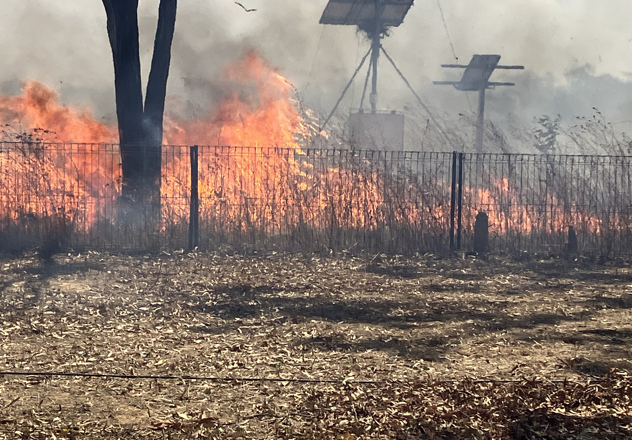The ferocious blaze jumped the temporary fire block and roared toward the homestead.
