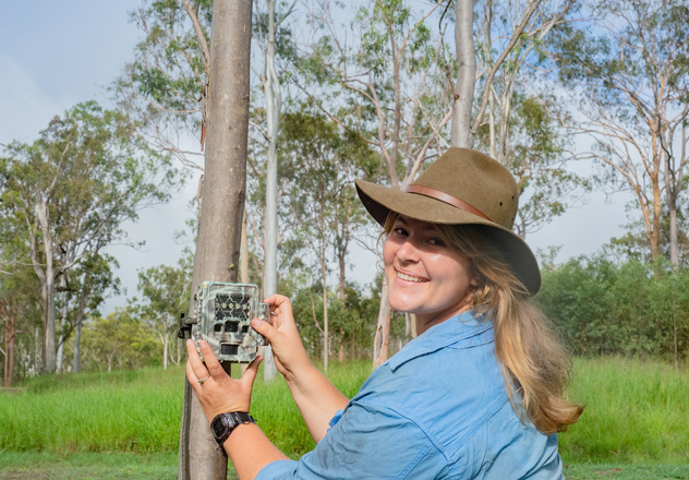 Field Ecologist Melissa Christi Setting A Camera Trap Device To Monitor Wildlife On Sanctuary